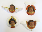 After seeing the cherubs painted all over the churches, it was an obvious parallel to draw on them for the favors. Here, a few different shapes and styles.