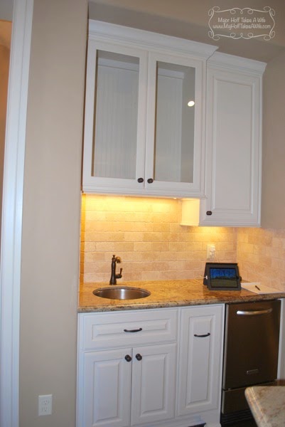 Wine corner with wine fridge, bar sink and glass cabinet doors.jpg Wine corner with wine fridge bar sink and glass cabinet doors