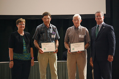 Washington County 4-H Alums Gale Whitacre (left) and Harold Wylie (right) are inducted into the Iowa 4-H Hall of Fame Sunday at the Iowa State Fair in Des Moines.  Photo courtesy of the Washington County Extension.