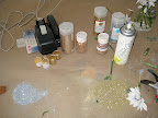 The glitter, luster dust, and spray we used for the bouquet. We put down kraft paper first, which we recommend as it makes clean up much easier.