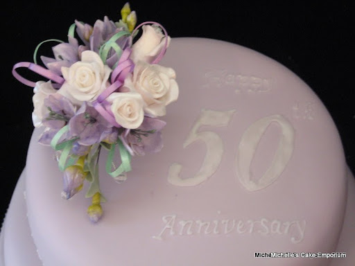 lilac 50th wedding anniversary cake with sugar rose and freesia cake topper