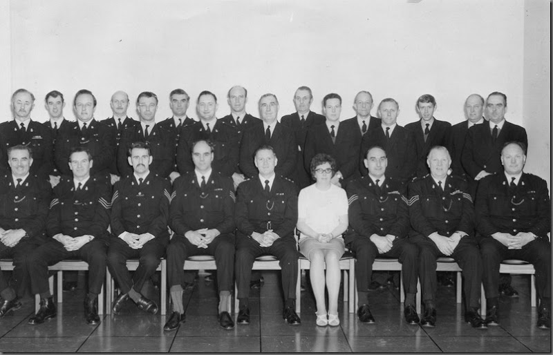 Motor School Staff photo, c.1972, the move from Sedgefield to HQ<br /> Back Row, Ted Barber, Alan Drake, Dick Hart ?, Barney Conlon, Graham Suddick, Vic Dunn, John Nixon, Peter Willis, Jock Little, Cec Melville, Fred McDonald, Johnny Waller, Norman Galloway, John Glendinning, Joe Millican, ?<br /> Front Row, Cyril Pearson, Jock Murphy, Alan Miller MPO Sgt (later transferred to N’bria), Fred Anderson, Alf Charlton, Mary Lancaster, Tommy Lingwood, Dave Hodgson, Harry Lancaster Motor School Staff photo, c.1972, the move from Sedgefield to HQ<br /> Back Row, Ted Barber, Alan Drake, Dick Hart ?, Barney Conlon, Graham Suddick, Vic Dunn, John Nixon, Peter Willis, Jock Little, Cec Melville, Fred McDonald, Johnny Waller, Norman Galloway, John Glendinning, Joe Millican, ?<br /> Front Row, Cyril Pearson, Jock Murphy, Alan Miller MPO Sgt (later transferred to N’bria), Fred Anderson, Alf Charlton, Mary Lancaster, Tommy Lingwood, Dave Hodgson, Harry Lancaster