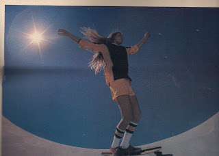 Hair blowing into the sky with the sun shining like a star while Laura is floating around the bowl.