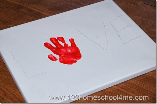 In pencil lightly right L _ V E. Now stamp hand where the o would be In pencil lightly right L _ V E. Now stamp hand where the o would be