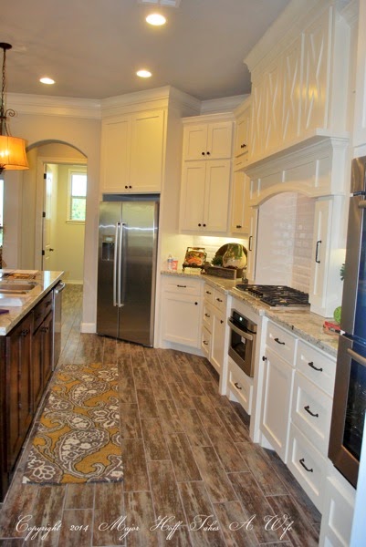 white kitchen with barn door styling and subway tile.jpg White kitchen with barn door styling and subway tile