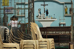 A resident cleans up the small chapel after the flood subsided at Sapamanai village, Fairview, Quezon City. (Photo by RVO/Bulatlat.com)