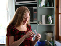 Bronwen reading her “Extra Special Birthday Vouchers”