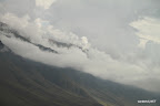 Smooth hill-side covered in clouds