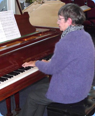 Club Secretary, Colleen Kerr, playing The Holy Cross Church's Broadwood Grand Piano.
