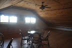 Above the barn is this loft (complete with its own bar) for the groom and his party to get ready before the big show.