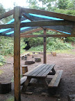 Royce-Finel has sparse amenities in a few campsites. There are a few tarp shelters (bring your own tarp), picnic tables, and fire rings.