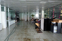 Mostly clean floor, with furniture and carpet removed from everywhere
