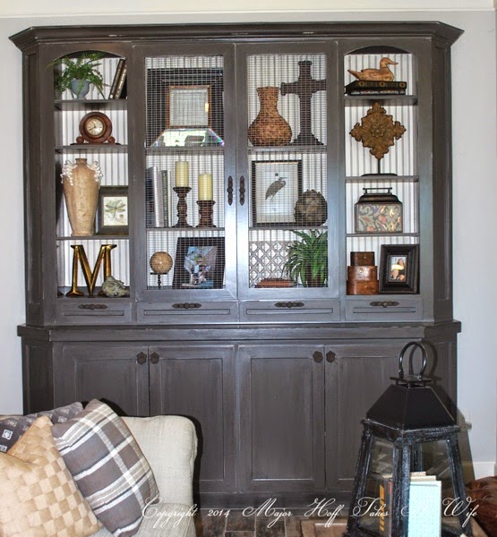 custom built in living room cabinet with arched doors.jpg Custom built in living room cabinet with arched doors