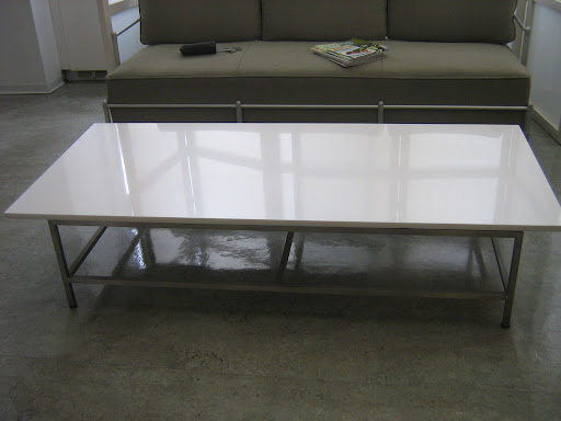 Here it is, polished and ready to be moved into my apartment. The top is white glass and the legs are metal. Here it is, polished and ready to be moved into my apartment. The top is white glass and the legs are metal.