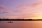 A vibrant sunset on one of the lakes in Obatanga