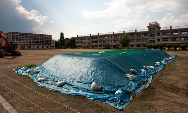 Soil contaminated by radiation from the Fukushima Daiichi nuclear plant is stored at a school in Koriyama, Japan. Ko Sasaki for The New York Times