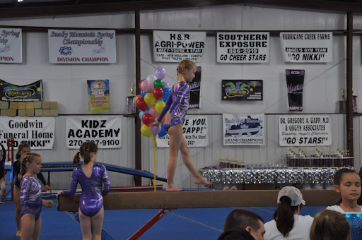 Kate warms up on beam