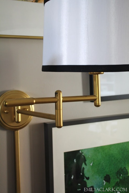 brass wall lamp with ribbon trim
