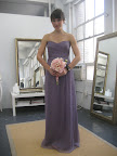 The girls will wear this floor-length Amsale chiffon gown in charcoal.