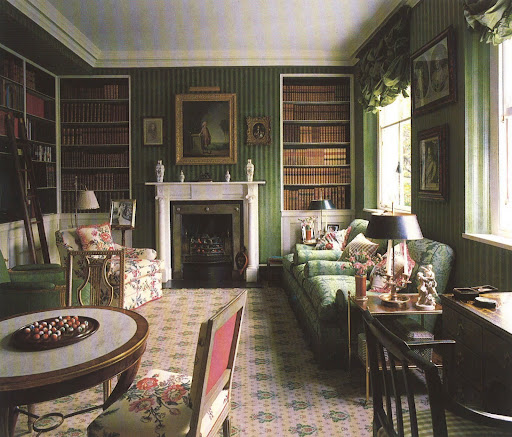 This library's covered walls, in a green velour de lin, works so well with the Buxted carpet, damask upholstery and hints of floral.