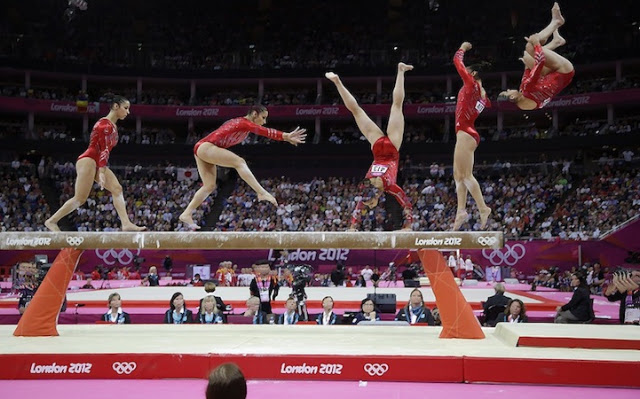 In this multiple exposure photo, U.S. gymnast Alexandra Raisman performs on the balance beam during the Artistic Gymnastics women's team final at the 2012 Summer Olympics, Tuesday, July 31, 2012, in London. (AP Photo/Julie Jacobson)