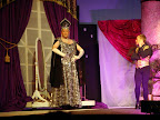Roger (Sean VanAusdall-Rose), looking like the Chrysler building, and Carmen (T. J. Grasch)