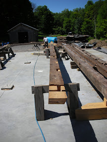 Three of the barns four tie beams had severe rot at both ends.  We decided to shift the joinery and scarf only one new end to these ties.
