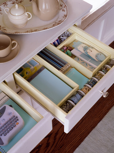 Supplies can be organized in an extra drawer. This one is designed to hold silverware.