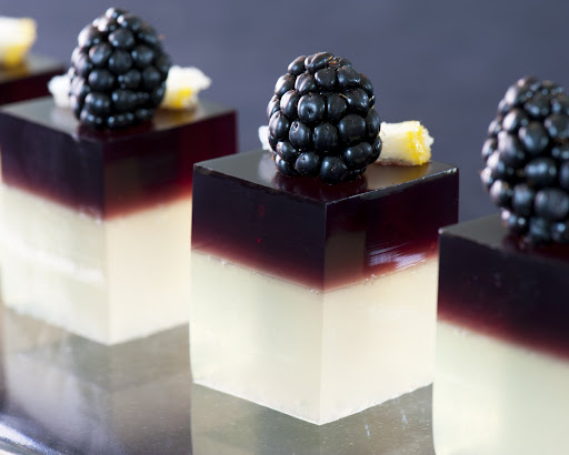 Bramble cocktail shots with blackberries