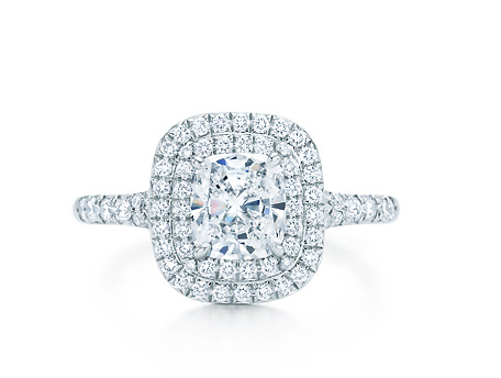 Perfect for the girl desiring a big look, the hallmark of the Tiffany Soleste is the double row of bead-set diamonds encircling a cushion modified brilliant cut center stone. Perfect for the girl desiring a big look, the hallmark of the Tiffany Soleste is the double row of bead-set diamonds encircling a cushion modified brilliant cut center stone.