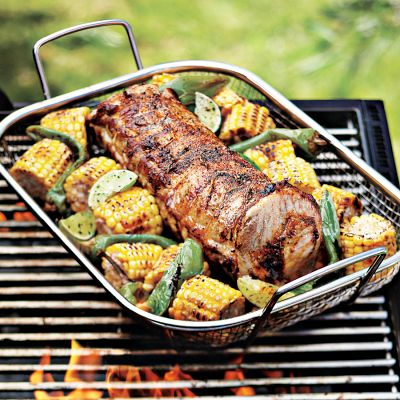 Grilling vegetables is tricky. Use a cooling rack or this wire basket with a grid pattern to grill smaller items that would normally slip through the grates. (williams-sonoma.com) Grilling vegetables is tricky. Use a cooling rack or this wire basket with a grid pattern to grill smaller items that would normally slip through the grates. (williams-sonoma.com)