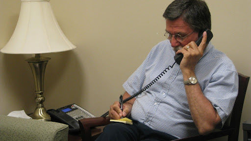 Counselor Ray Burmood takes a call in his office at the Vet Center. The center is 100% staffed by veterans. (photo by: Kenrick Nobles)