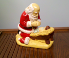 c0_ Kneeling Santa with Baby Jesus by Rudoph Vargas commissioned by Raymond P Gauer
