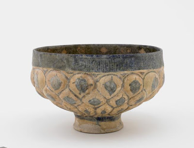 Footed bowl | Origin:  Kashan,  Iran | Period: 13th century  Saljuq period | Details:  Not Available | Type: Earthenware molded and painted with glaze | Size: H: 12.1  W: 19.5  cm | Museum Code: S1997.112 | Photograph and description taken from Freer and the Sackler (Smithsonian) Museums.