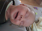 Audrey is just beginning to smile for something other than gas. It usually happens when she's drifting off into sleep, but more and more, she's smiling while she's awake. Tough to catch a photo so far of it, but it happens.