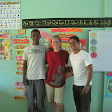 Belizeur, Sarah and Kelvin with a fun wall in the First grade class.