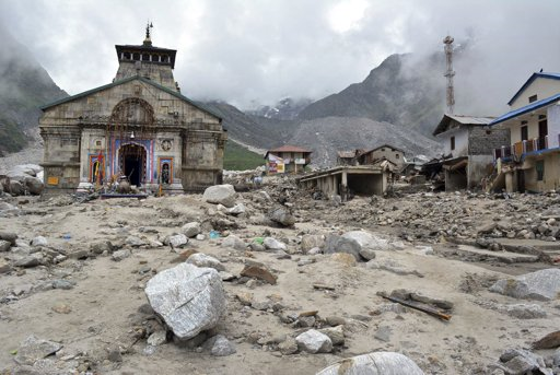 In this 20 June 2013 photo, the Kedarnath shrine, one of the holiest of Hindu temples dedicated to Lord Shiva, and other buildings around it are seen damaged following monsoon rains in at Kedarnath in the northern Indian state of Uttrakhand. A joint army and air force operation evacuated thousands of people stranded in the upper reaches of the state of Uttrakhand where days of rain had earlier washed out houses, temples, hotels, and vehicles. Photo: AP