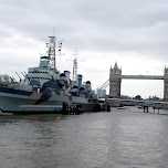 warship in front of the london tower bridge in London, United Kingdom 