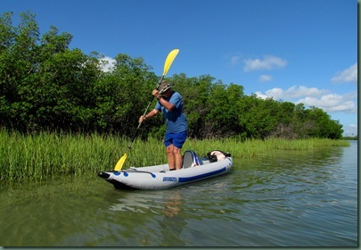 Al standing and paddling in Sea Eagle