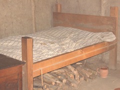 Plimoth Plant bed w firewood under it and chamberpot