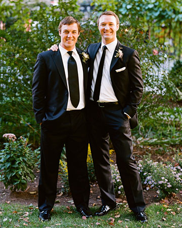 This groom and his best man sported the same black suit but chose different ties -- one skinny, one wide -- to set them apart. This groom and his best man sported the same black suit but chose different ties -- one skinny, one wide -- to set them apart.