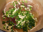 Scallions and garlic sauteing in olive oil.