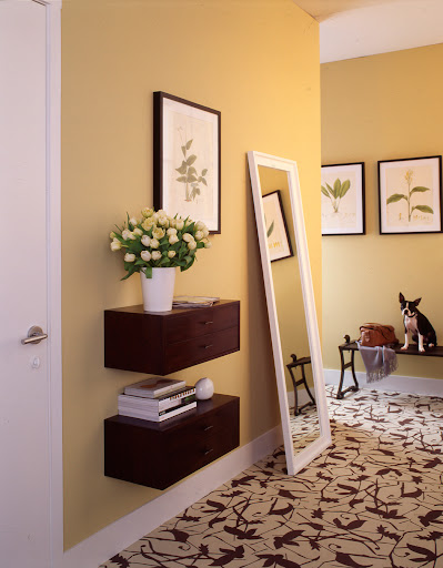 For a sleek entryway look, try installing floating drawers. And the bigger the mirror the better. Opt for a full-length mirror if you have the space.