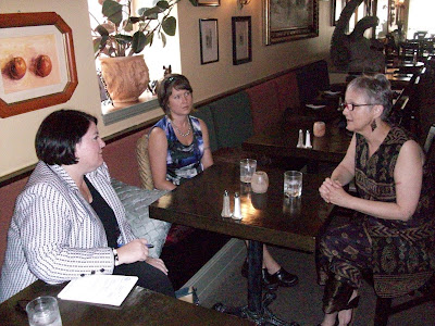 Tsalika Drown and Lorraine Williams from Cafe Dodici talk with Alison Hart, an Aide from Senator Tom Harkin's Office Tsalika Drown and Lorraine Williams from Cafe Dodici talk with Alison Hart, an Aide from Senator Tom Harkin's Office