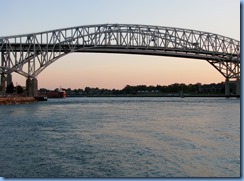 3715 Ontario Sarnia - Blue Water Bridge over St Clair River at sunset - Great Lakes Trader barge being pushed by the tug Joyce L. VanEnkevort