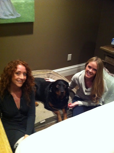 Adopt-a-Pet.com's Abbie Moore and Kelly Backes, with Rodney, Abbie's favorite among Backes' rescued pooches.
