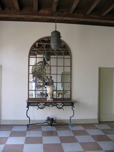I feel transported in this loggia and adore the pink checkered terrazzo floor.