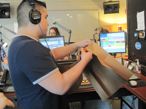 Steve is cutting his paper bag to scale