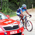 Eritrean Daniel Abraham from the Marco Polo Cycling Team at the team cars in the Druivekoers Overijsse in Belgium. (photo: Gerd Ramme)