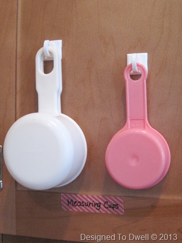 Measuring cups hang on the baking cabinet door. IMG_7099